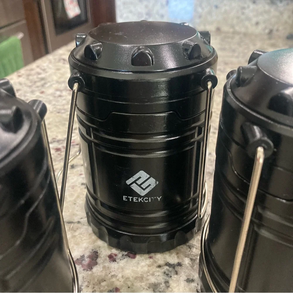 Set of 4 Etekcity black LED travel/camping lanterns Preowned **No Batteries**
